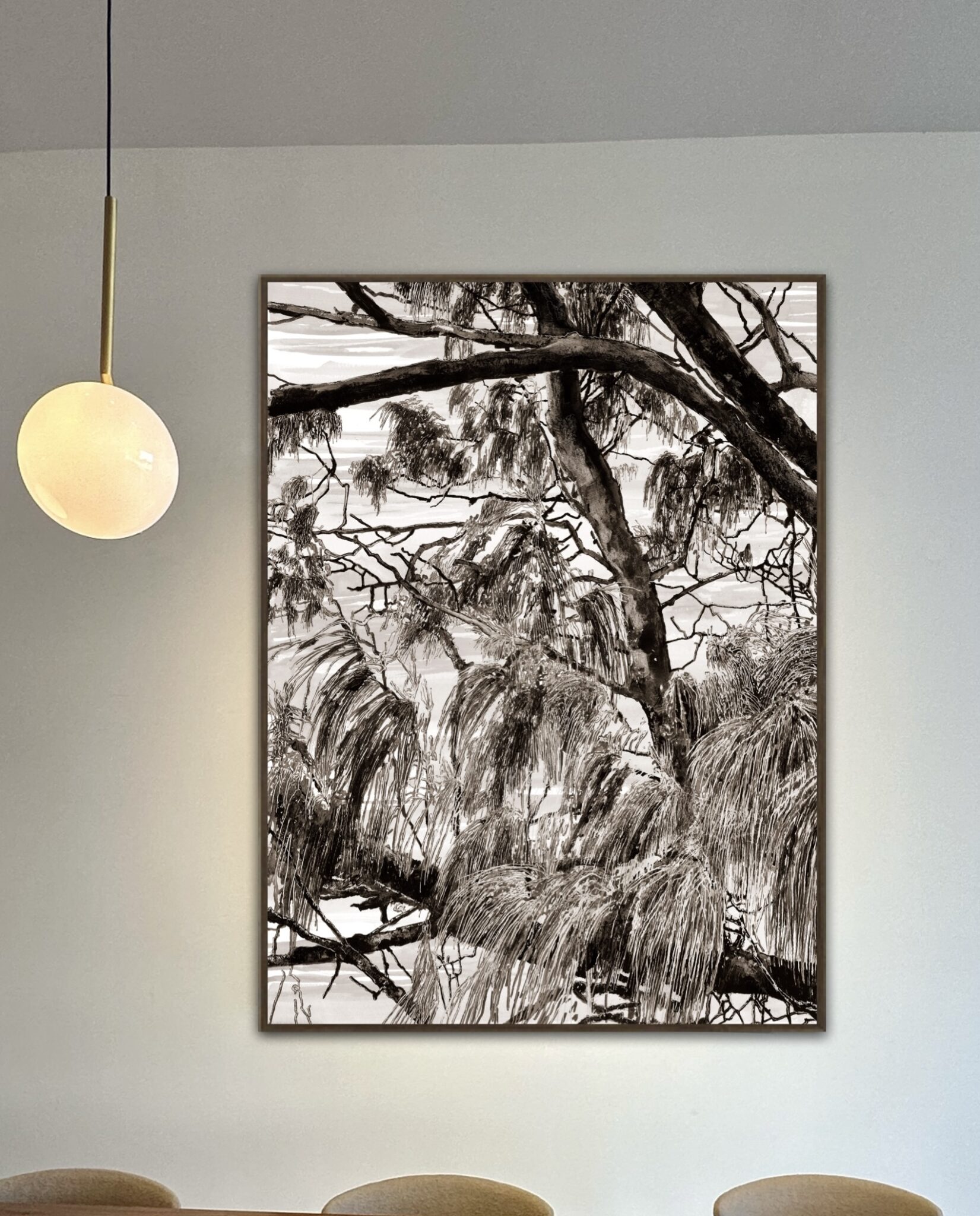 A trees painting displayed prominently in the center of a living room
